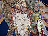 Mustang Lo Manthang Tiji Festival Day 1 03 Old Thangka Of Guru Rinpoche Padmasambhava Around 13:30 horns, drums and cymbals announced the beginning of the 3-day Tiji festival in Lo Manthang, when an enormous old thangha of Guru Rinpoche (Padmasambhava) was unrolled down the entire south wall of the square.